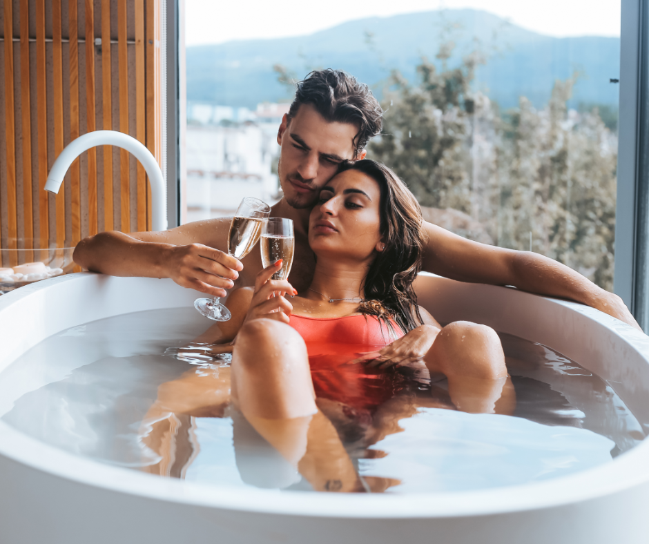 sugar couple enjoying their vacation time with a passionate bathtub experience