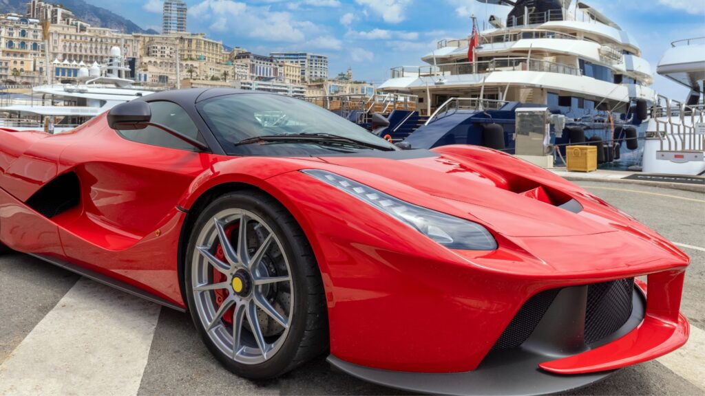 sugar daddy in his super car near his yacht 